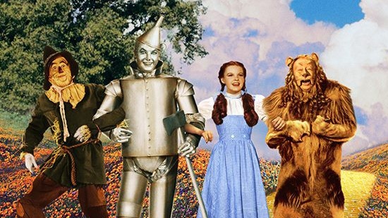 Dorothy with the Scarecrow, Tin Man, and Cowardly Lion on the yellow brick road